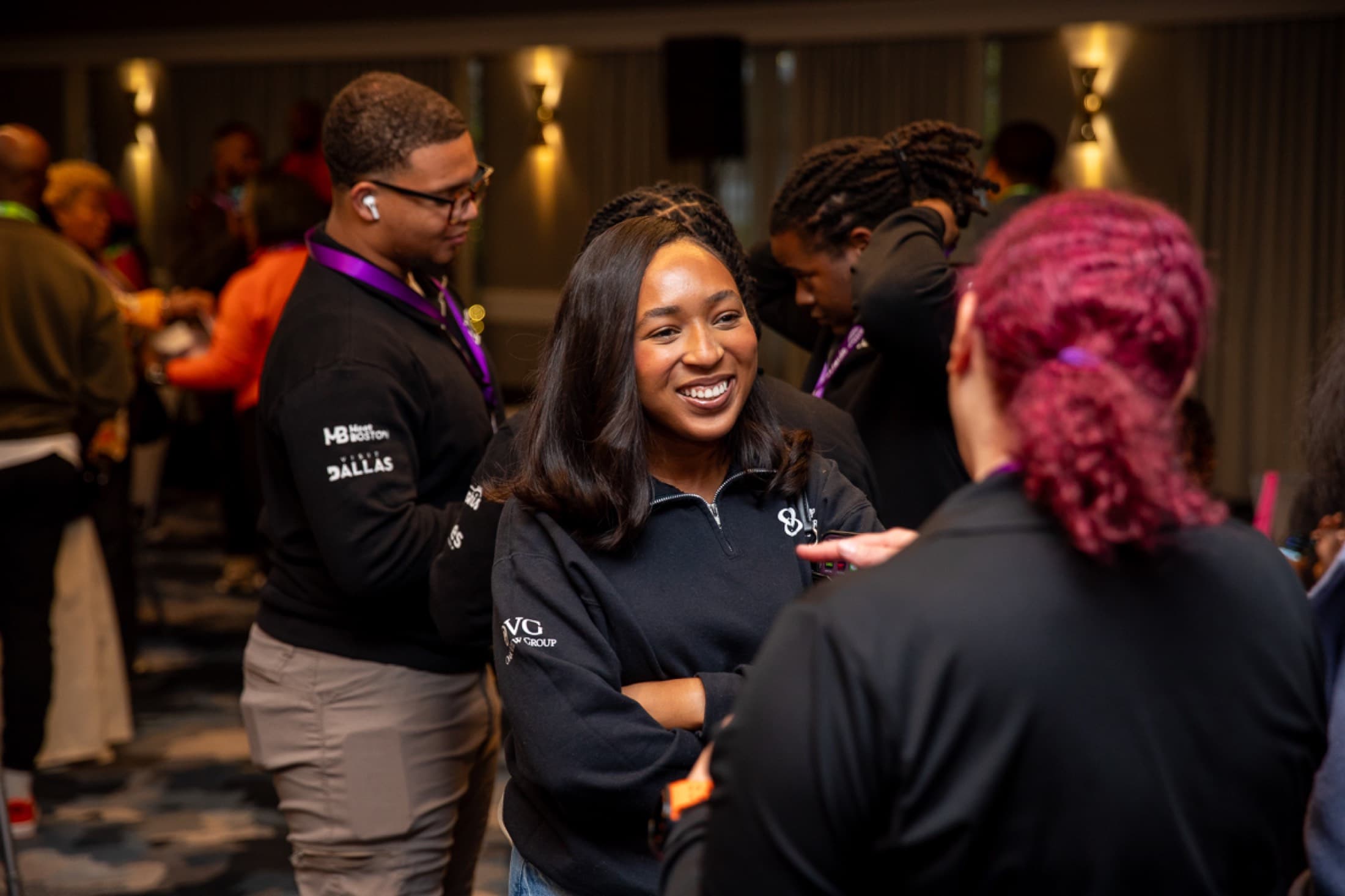 Candid networking moment between attendees at a professional gathering